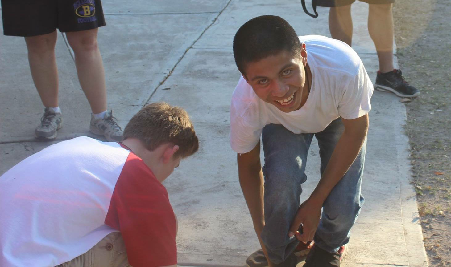 Young man putting shoes on in Mexico