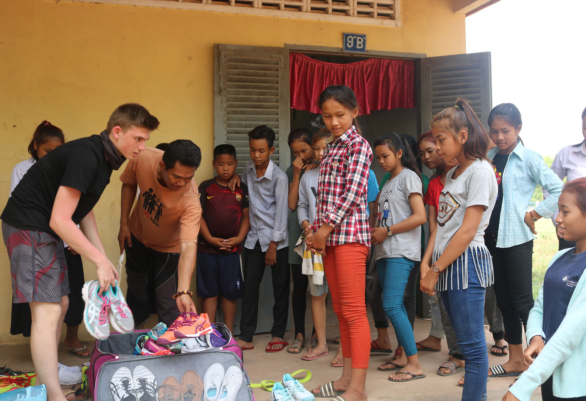 Cambodia students receiving shoes