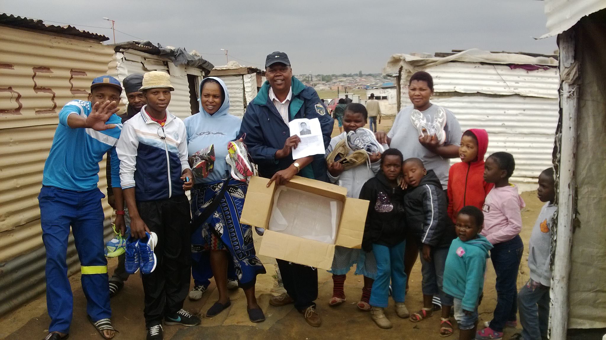 Families receiving shoes in Soweto, South Africa